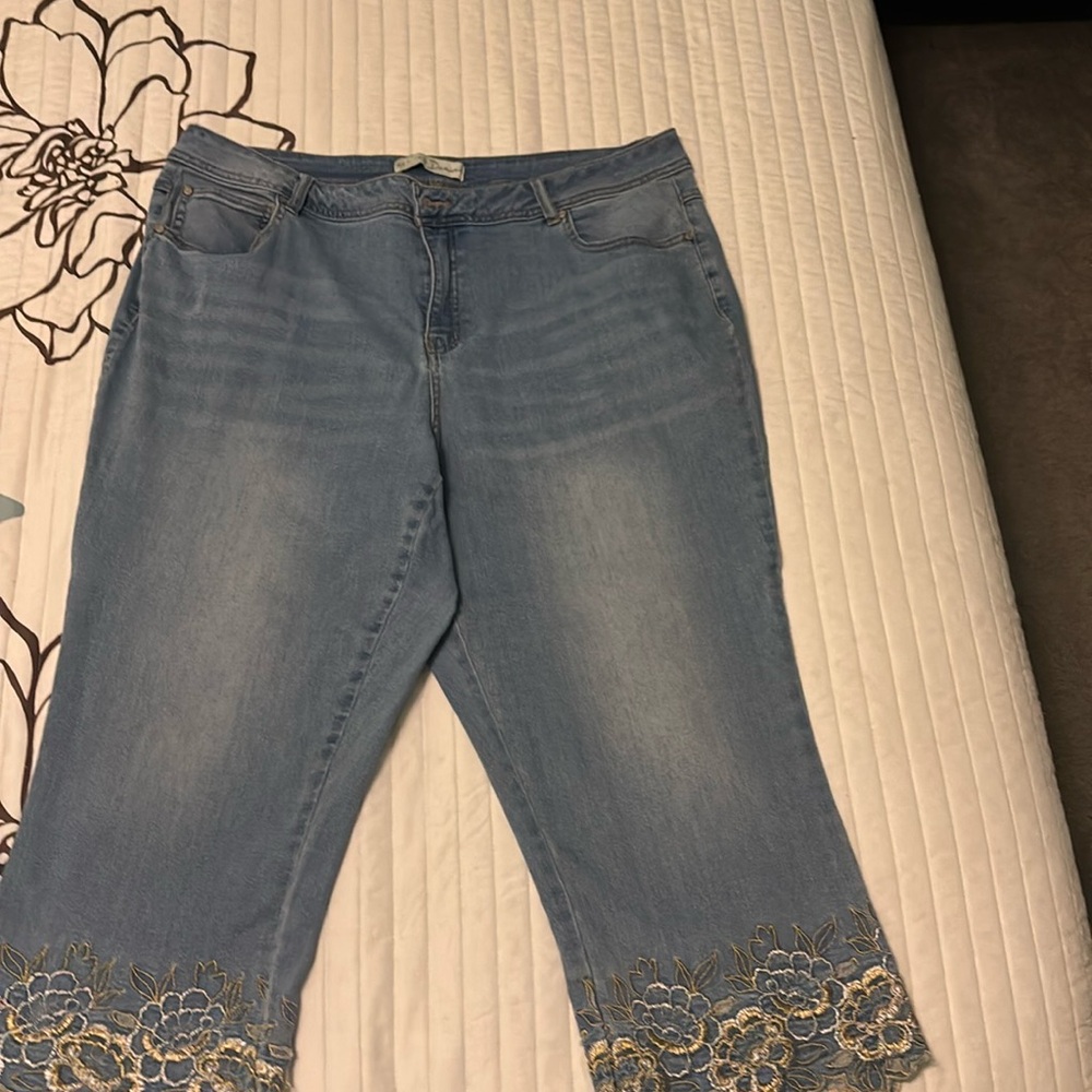 Adorable denim capri pants with embroidered hems.